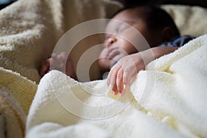 asian new born sleeping focus hand