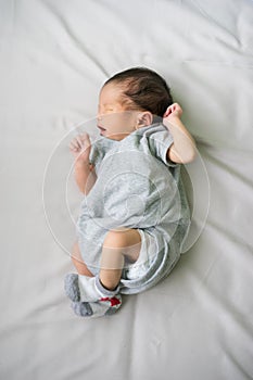 Asian newborn baby in hospital, delivery room