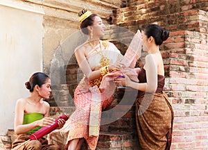 Asian noble beauty with maids dressed in traditional clothes shopping in old retro historical period theme