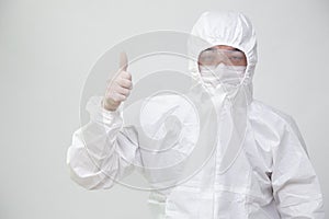 Asian nurse or doctor in Personal Protective Equipment with gesture up confidence and thumbs up