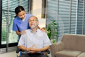 Asian Nurse take care Elderly Senior Man with warm welcome. 70s Mature Man patient has good health and support help by Caregiver