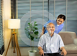 Asian Nurse take care Elderly Senior Man with warm welcome. 70s Mature Man patient has good health and support help by Caregiver