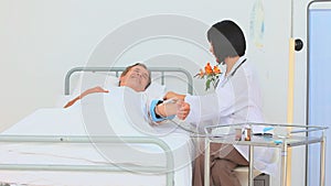 Asian nurse taking the blood pressure