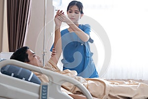 Asian nurse therapists  stretching arm muscles treatment of physiological.