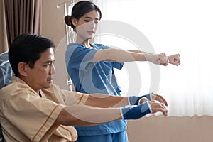 Asian nurse therapists  stretching arm muscles treatment of physiological.