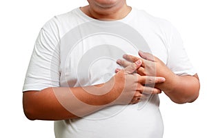 Asian obese man having health problems, having pain in the heart,