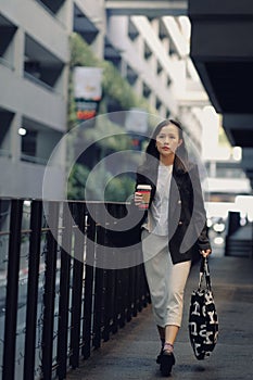 asian office women and coffee cup  with face mask