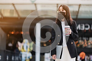 asian office women and coffee cup  with face mask