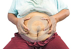 Asian old fat woman grasp her abdomen photo