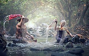 Asian old women washing clothes