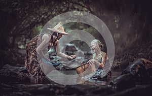 Asian old women working in the rain forest, Thailand