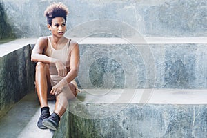 asian pacific islander athlete girl with afro after workout performing exercising routines