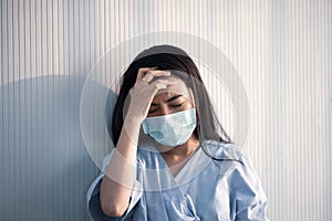 Asian patient woman wearing mask protect virus from sickness in hospital