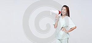 Asian patient woman wearing patient gown shouting loud holding a megaphone speaking for compensation coverage or tell insurance