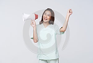 Asian patient woman wearing patient gown shouting loud holding a megaphone speaking for compensation coverage or tell insurance
