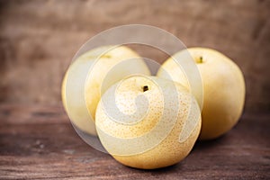 Asian pear fruit on wooden background