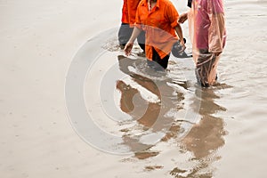 Asian people walking on flooding road during monsoon season