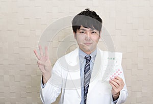 Asian pharmacist gesturing number three