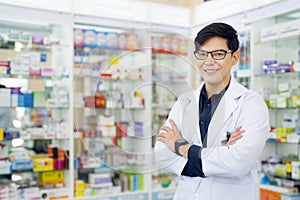 Asian pharmacist man in pharmacy store