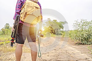 Asian photographers carry a camera bag along