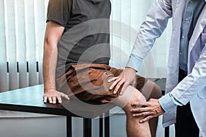 Asian physiotherapists are checking patients' knees