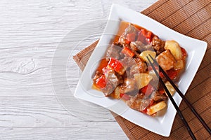 Asian pork with pineapple in sweet and sour sauce. top view