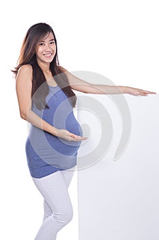Asian pregnant woman with a blank whiteboard, isolated