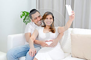 Asian pregnant woman and husband