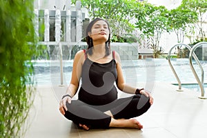 Asian pregnant woman meditate