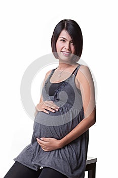 Asian pregnant women listening her baby