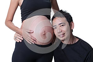 Asian pregnant women listening her baby