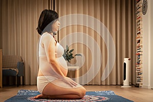 asian Pregnant Yoga for birth preparation