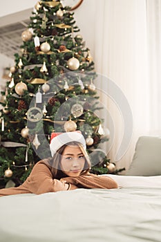 Asian pretty Girl celebrates Christmas at home