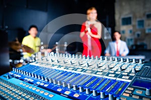 Asian professional band in recording studio mixing