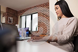 Asian programmer using software app with encryption