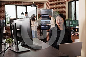 Asian programmer typing machine learning server code