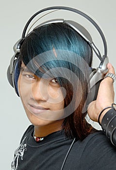 Asian punker portrait with headphones