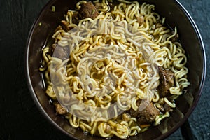 Asian quick noodles on wood background photo