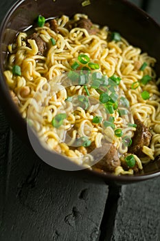 Asian quick noodles on wood background photo