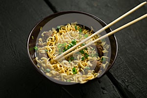 Asian quick noodles on wood background photo