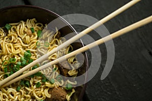 Asian quick noodles on wood background photo