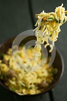 Asian quick noodles on wood with focus and blur background