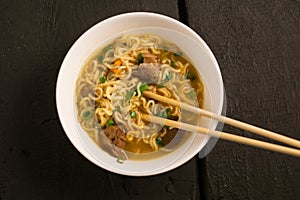 Asian quick noodles on wood with focus and blur background