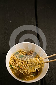 Asian quick noodles on wood with focus and blur background photo