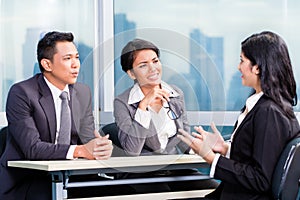 Asian recruitment team hiring candidate in job interview photo