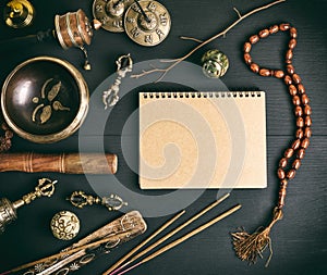 Asian religious musical instruments for meditation and notebook