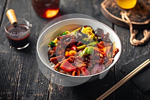 Asian rice bowl dish with vegetables and meat