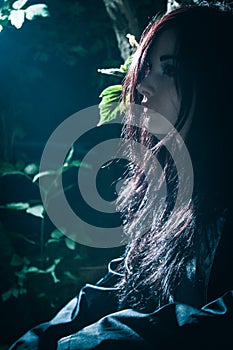 Asian rocker girl in a forest