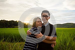 Asian,Romantic couple or Homosexuality, female love hug on the rice field with sunset