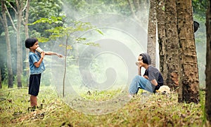 Asian Rural children girl talking communicate with can phone.The joy of communication among childrens in rural Asia photo